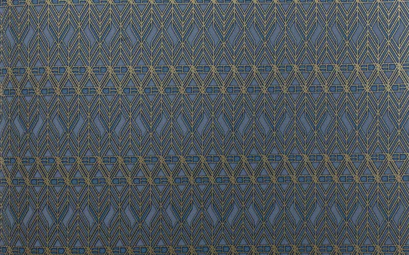 Серо-синие бумажные обои York Tailored HO3348 с золотистым геометрическим узором